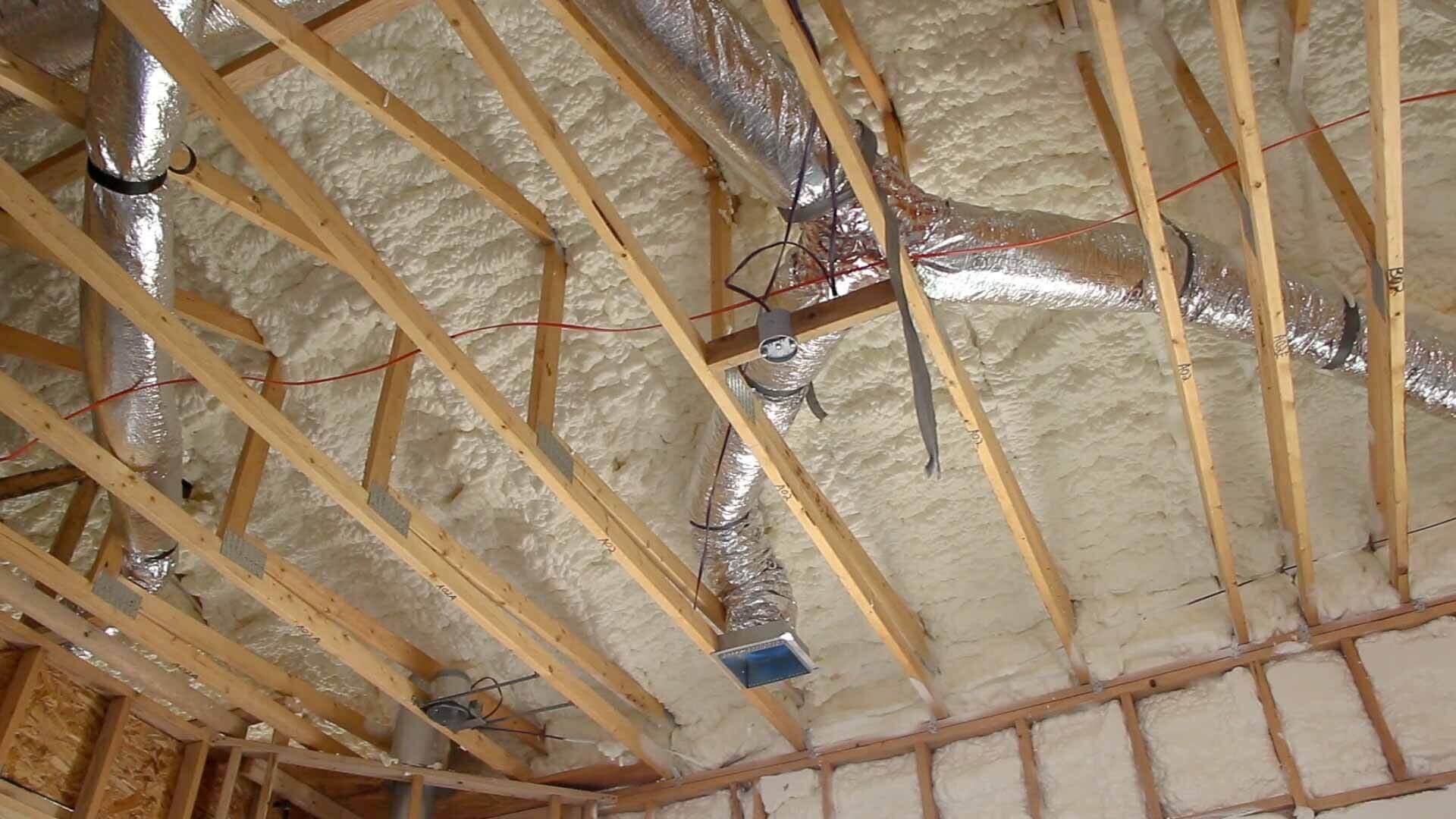 Spray foam insulation applied to a ceiling and rafters in Edmonton
