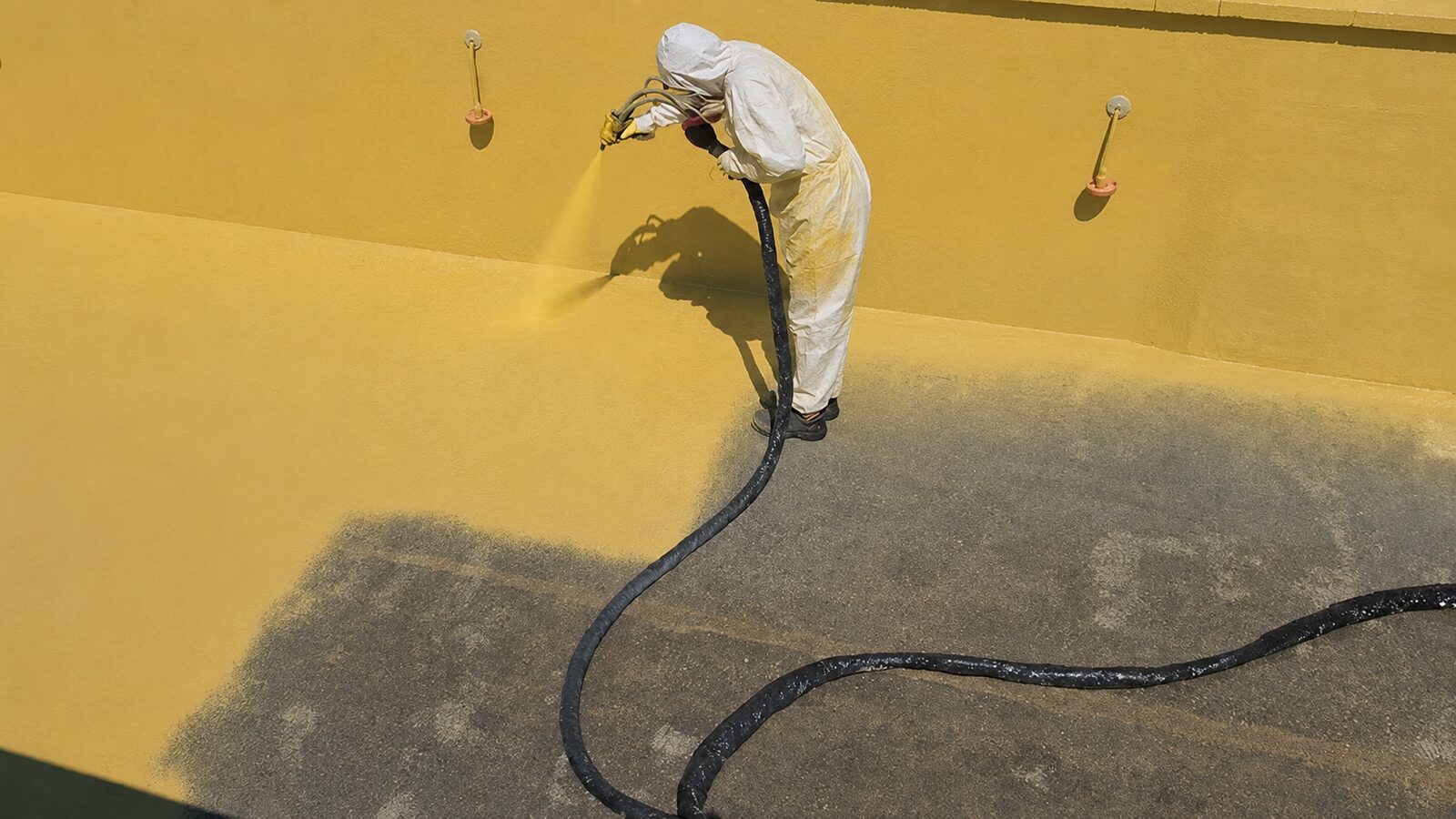 Polyurea spray waterproofing coating application Edmonton